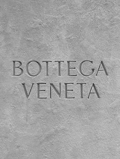 the words bottega veneta are etched in concrete