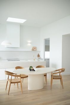 a white table and chairs in a room