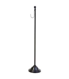 a black umbrella stand with an umbrella on it's end and a hook hanging from the top