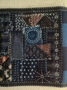 a piece of cloth with many different patterns on it and one patchwork design in the middle