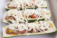 zucchini stuffed with meat and cheese on a white plate