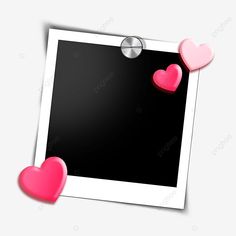 two pink hearts hanging on a white photo frame with clippings to the side