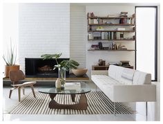 a living room filled with furniture and a fire place