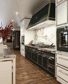 a large kitchen with an oven, stove and counter tops in the middle of it