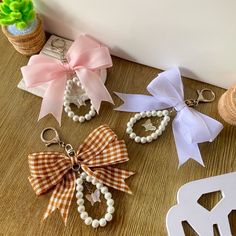 several bows and key chains on a table