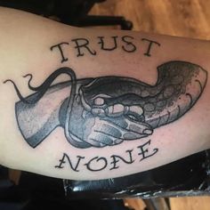 Top 69 Best Trust No One Tattoo Ideas 2021 Inspiration Guide Trust No One Tattoo Ideas, Trust No One Tattoo, Trust None, Trust Tattoo, Pashmina Saree, Tattoo On Back, Snake Tattoos, One Tattoo, Sketches Ideas