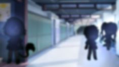 blurry image of people walking down a hallway