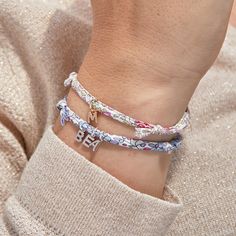 The A-Z of you and me. Add a floral burst of colour to your jewelry collection with our Mini Alphabet Charm Liberty Bracelet. Choose your favourite Liberty print to pair with up to 5 delicate letter charms to represent loved ones or spell out the words closest to your heart.18K Champagne Gold Plated and 925 Sterling SilverMini Alphabet charm: 0.2Liberty braid with fully adjustable sliding knot fasteningSent with love in a complimentary gift boxChildren’s Warning: please note, this piece of jewel Liberty Bracelet, Bracelets Liberty, Alphabet Charm, Mini Charm, Sliding Knot, Liberty Print, Letter Charms, Champagne Gold, Jewellery Collection