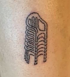 a black and white photo of a tattoo on someone's left leg with a tire tread