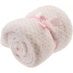 a blanket with a pink bow on it is folded up and ready to be used