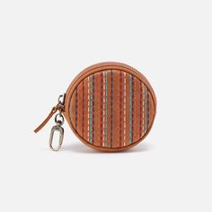 a small coin purse with a keychain hanging from the front and an orange stripe pattern