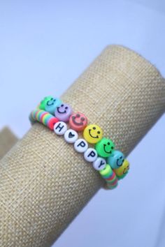 These cute and fun BE HAPPY handmade clay bead bracelets are stretchable and will fit most children's and adult's wrist comfortably. This is sold as a set.  Please do not overstretch the bracelets, as they will only stretch but so much and may snap.  SIZING: These bracelets are approximately 7 inches. Please message me if you have any questions!! ;-) Clay Bead Bracelets, Happy Faces, Trendy Bracelets, Clay Bracelet, Clay Bead, Happy Fun, Bead Bracelets, Handmade Clay, Happy Face