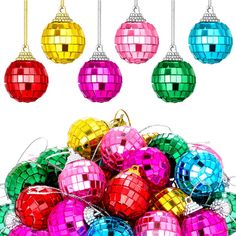 colorful disco ball ornaments hanging from strings in front of a white background with space for text