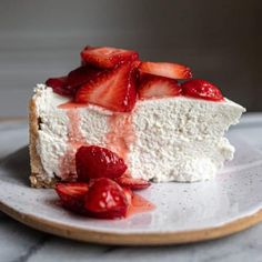 a piece of cheesecake with strawberries on top