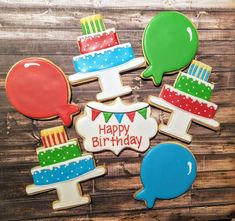 decorated birthday cookies on a wooden table