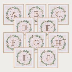 six cross stitch alphabets are arranged in the shape of wreaths