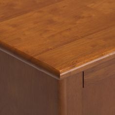 a close up view of a wooden table with no one on it's legs