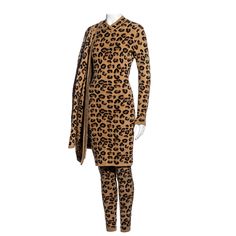 ▪ Azzedine Alaia leopard wool four-piece set ▪ Long sleeve fitted knee-length dress ▪ Oversized button-up cardigan ▪ High-waisted leggings ▪ High-waisted fitted knee-length pencil skirt ▪ Can be styled as multiple outfits or worn individually ▪ Size Medium ▪ 38% Worsted Wool, 36% Rayon, 33% Nylon, 3% Spandex ▪ Fall-Winter 1991 Fitted Knee Length Dress, Cardigan Skirt, Red Leather Skirt, Azzedine Alaïa, Dress Cardigan, Corset Skirt, Multiple Outfits, Azzedine Alaia, Knee Length Skirt Pencil