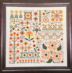 a cross stitch pattern with flowers on it