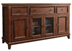 a large wooden cabinet with glass doors on the front and bottom drawers, in dark wood