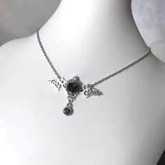 This gothic vampire inspired necklace is made with an antiqued silver plated filigree bat and findings, accented with sparkling glass crystals in DEEP VIOLET PURPLE. Wingspan is 2 1/4" wide and centerpiece is 1 1/2" tall in the center.necklace isadjustable 15-18" with a lobster clasp and chain extender in the back. If you would like a different length or stone color, please send us a message. Matching headpiece is available in our store. Goth Jewelry Violet Vixen, Wedding Goth, Dark Amethyst, Vampire Queen, Gothic Vampire, Gothic Victorian, Choker Pendant, Inspired Necklace, Purple Necklace