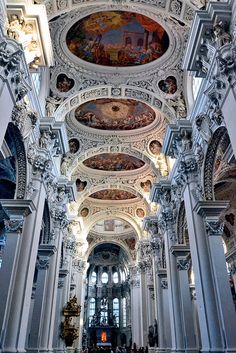 the interior of a large church with painted ceilings and ceiling murals on it's walls