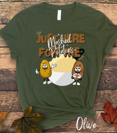 "\"Get Your Spuds On! 🥔 Just Here for the Mashed Potatoes 🥔 Join our potato squad and celebrate Thanksgiving and Christmas Dinner with a side of humor. Our hilarious t-shirt features adorable cartoon potatoes striking a pose in front of a bowl of creamy mashed goodness. 🍽️ 🎁 The Perfect Gift for Family and Friends 🎁 This tee is the ultimate conversation starter for your holiday gatherings. Share a laugh with your loved ones while enjoying the festive feasts. 🌈 Available in a Rainbow of Col Day Dinner Outfit, Potato Party, Cartoon Potato, Funny Potato, Thanksgiving Funny, Creamy Mash, Thanksgiving Fashion, Dinner Outfit, Adorable Cartoon