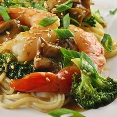 a white plate topped with noodles and vegetables