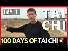 a man giving the thumbs up in front of a sign that reads tai chi 100 days of taichi