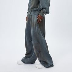 The Distressed Crinkled Baggy Sweatpants are a unique fusion of relaxed style and textured design. These sweatpants showcase a stonewashed, distressed look, creating a vintage and worn-in appeal that is both fashionable and comfortable. A distinctive feature of these pants is the double crinkled design strategically placed on both the inner and outer sides of the legs, adding an interesting visual and tactile element to the garment. The oversized silhouette of the pants offers a contemporary, re Baggy Washed Pants For Streetwear, Acid Wash Baggy Pants For Streetwear, Baggy Acid Wash Pants For Streetwear, Faded Relaxed Fit Full Length Bottoms, Wide Leg Washed Pants For Streetwear, Faded Full-length Bottoms With Relaxed Fit, Faded Full-length Relaxed Fit Bottoms, Oversized Washed Faded Bottoms, Relaxed Fit Distressed Full Length Bottoms