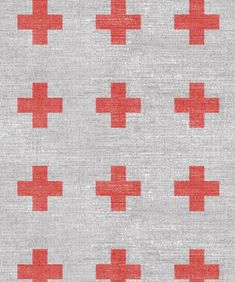 a red cross pattern on grey fabric