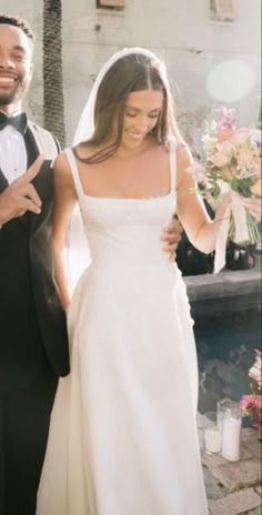 a bride and groom walking down the aisle