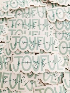 several stickers with the word joyful written on them in green and white colors