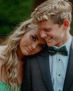 a young man and woman in formal wear