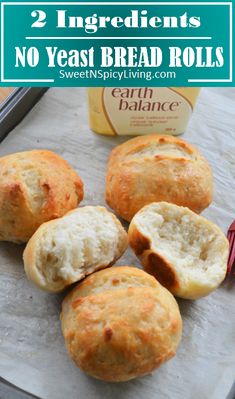 some bread rolls sitting on top of a baking sheet with the words, 2 ingredients no yeast bread rolls