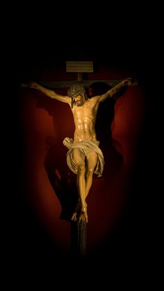 the crucifix is shown against a dark background