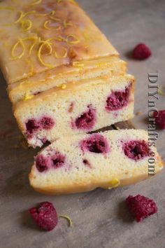 a loaf of raspberry pound cake on a cutting board