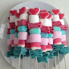 marshmallows are arranged on top of other marshmallows in the shape of hearts