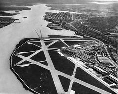 an aerial view of the airport and its surrounding area, taken in black and white