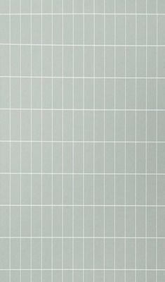 a white tile wall that is very clean and ready to be used in the bathroom