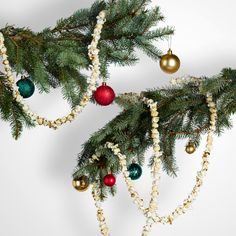 christmas ornaments hanging from the branches of a tree