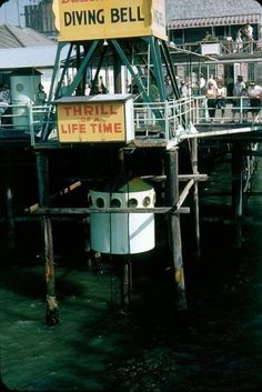 there is a sign that says diving bell on the dock