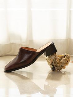 Editor's NotesThe chic mules are the summer essential that goes with everything in your spring to summer wardrobe.- Masculine silhouette mules- Slim square toe- Top stitching detail at the center- Soft touch- Wide sole- Sculptural heelsMeasuremets(in.)        - Size: KR225(US5.5) - KR250(US8)- Heel height: 1.6in. (4cm) / 2.4in.(6cm)Composition & Care- Cow leather, Fabric rattan- Avoid moisuture- Do not wash- Partial clean with a leather cleanerDesigner- Made in Korea- by Byeuuns Brown Square Toe Mules With Branded Heel, Classic Brown Square Toe Mules, Elegant Brown Summer Mules, Classic Block Heel Mules For Work, Classic Workwear Mules With Block Heel, Chic Slip-on Mules With Square Toe, Classic Mules With Stacked Heel And Square Toe, Classic Brown Mules For Office, Workwear Mules With Block Heel