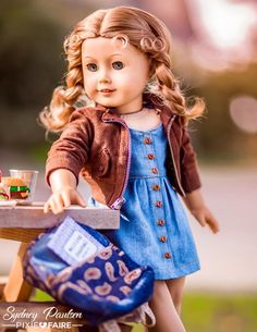 a doll is standing on a table holding a purse