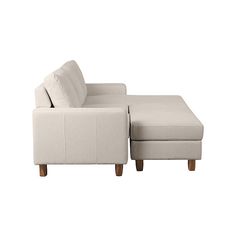 a white couch and ottoman with pillows on it