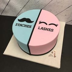 there is a cake that has two faces on it and the words lashes are in different colors