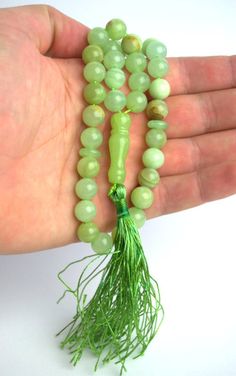 Green onyx mini mala with tassel A portable gemstone mini-mala that will easily fit into a pocket, purse or yoga bag. Compact and light weight, this pocket mala contains 33 x 10mm beads. Perfect for keeping with you all day long or at your bedside - for a few moments of quiet retreat and meditation. The ideal anti-stress gift. Traditionally evolved from prayer beads, worry beads no longer need to have religious significance but are a simple tool for calming and focusing the mind. Contact me if y Personalized Gifts For Him, Worry Beads, Opal Wedding, Opal Wedding Rings, Yoga Bag, Personalised Gifts For Him, Agate Jewelry, Worry Stones, Pretty Gift