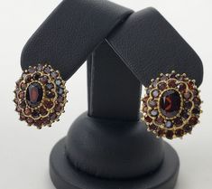 Celebrating 34 years in business and 23 years on eBay!! Our Store | Our Feedback | Contact Us                                     18k Yellow Gold 5.00ctw Garnet Oval Double Halo Leverback Earrings 3/4'' Brought to you by Pawn and Jewelry is this pre owned earrings. This auction is for the earrings only. They weigh 10.7grams or 6.9dwt, there are approximately 5.00ctw of garnets, and are about 3/4 inches long x 5/8 inches wide or 20.3mm long x 16.13mm wide. . Brand: Unknown Type: Earrings Style: L Classic Oval Cluster Earrings For Formal Occasions, Luxury Oval Cluster Earrings For Formal Occasions, Classic Oval Cluster Earrings For Gifts, Oval Gemstone Earrings For Formal Occasions, Formal Oval Pendant Gemstone Earrings, Elegant Oval Gemstone Cluster Earrings, Formal Oval Clip-on Earrings, Oval Gemstone Cluster Earrings For Anniversary, Oval Clip-on Earrings For Anniversary