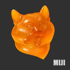 an orange gummy bear with its mouth open and tongue out on a black background