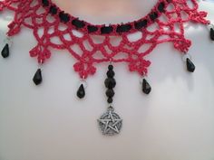 This beautiful red lace choker has black czech glass beads and a pewter silver pentacle. Black ribbon. Ties in back. Adjustable. Adjustable Red Gothic Jewelry, Handmade Halloween Choker Jewelry, Handmade Gothic Choker Jewelry, Red Gothic Choker For Festivals, Handmade Bohemian Jewelry For Halloween, Adjustable Crochet Jewelry For Festivals, Black Bohemian Crochet Jewelry, Black Crochet Bohemian Jewelry, Handmade Gothic Dangle Necklaces